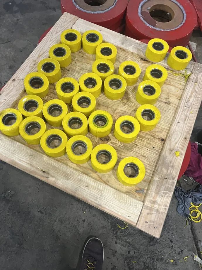 Cast urethane load wheels with pressed-in bearings